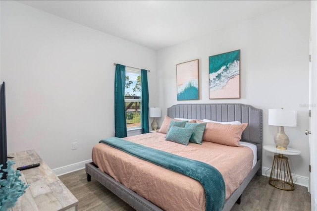 bedroom with hardwood / wood-style floors