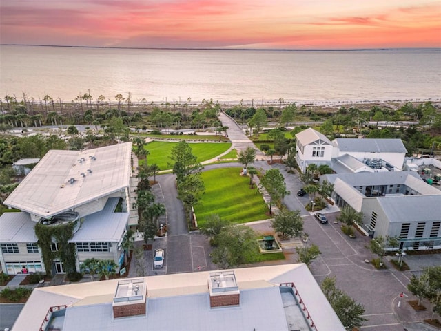 aerial view at dusk with a water view