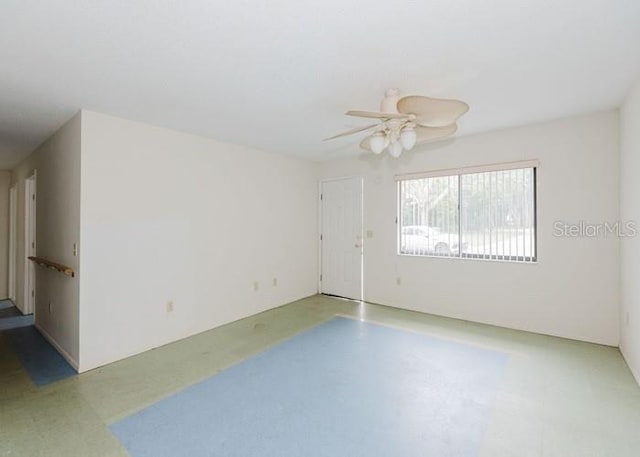 unfurnished room with ceiling fan