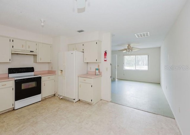 kitchen with light floors, light countertops, visible vents, white appliances, and under cabinet range hood