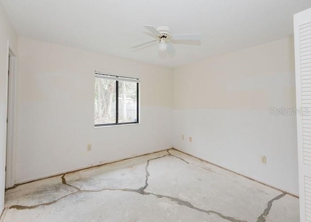 unfurnished room with concrete flooring and a ceiling fan