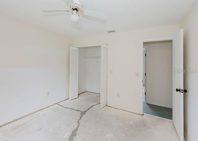 unfurnished bedroom featuring concrete flooring, a closet, visible vents, and ceiling fan