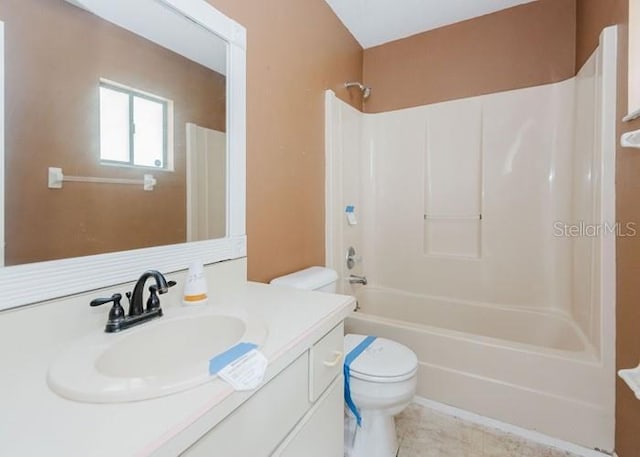 full bathroom featuring shower / bath combination, vanity, and toilet