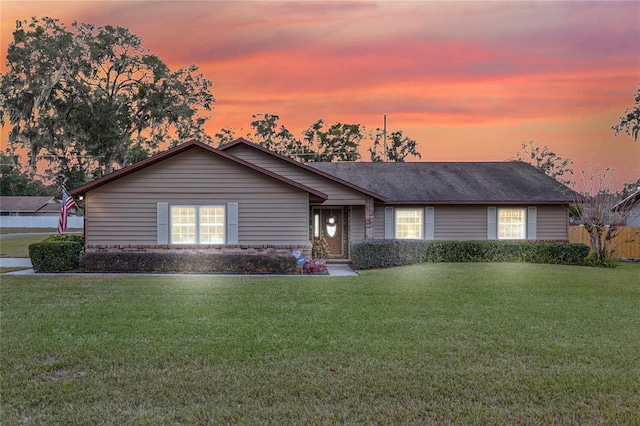 ranch-style house with a yard