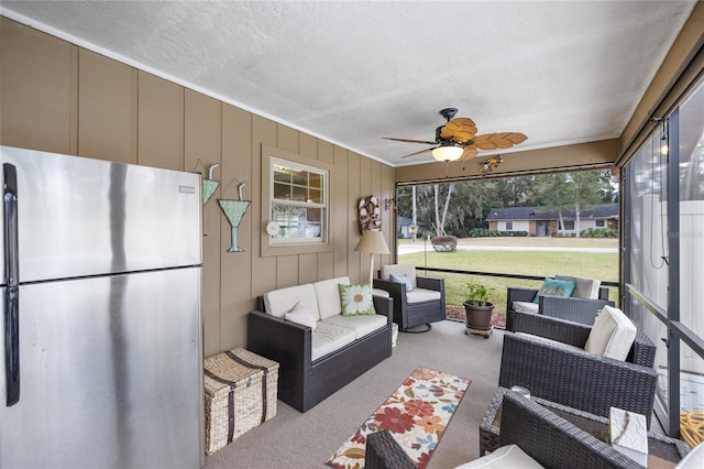 sunroom / solarium with ceiling fan