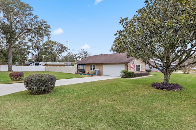 ranch-style house with a garage, central AC unit, and a front lawn