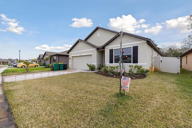 view of front of property featuring a garage and a front yard