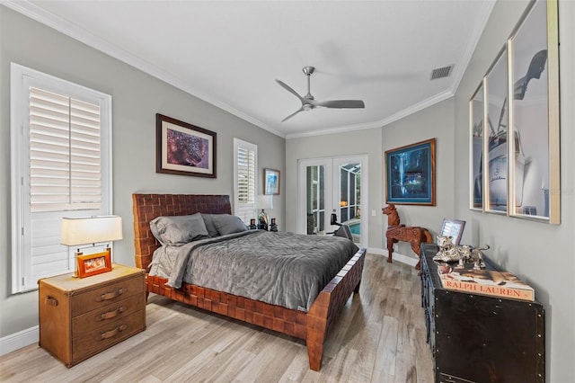 bedroom with crown molding, ceiling fan, french doors, light wood-type flooring, and access to exterior