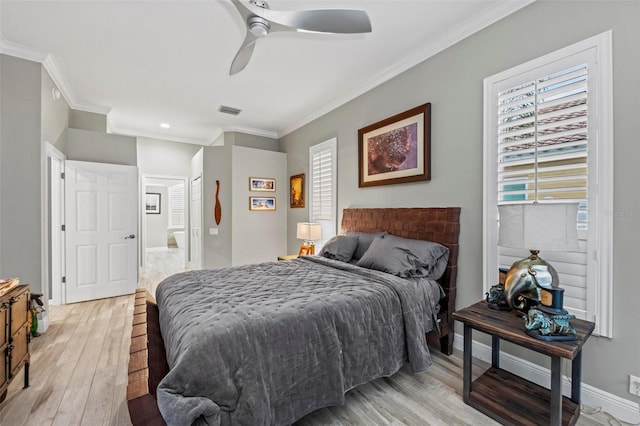 bedroom with ceiling fan, light hardwood / wood-style floors, and ornamental molding