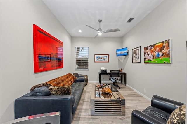 living room with hardwood / wood-style flooring and ceiling fan