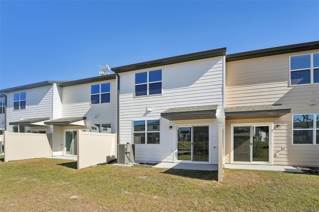 rear view of property featuring a yard