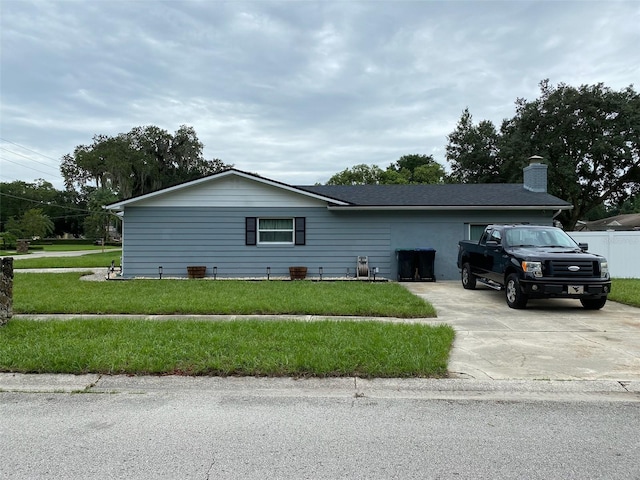 view of property exterior featuring a lawn