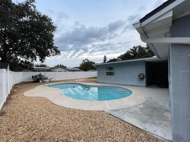 view of swimming pool with a patio area