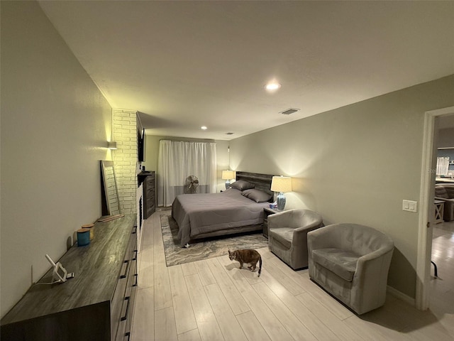 bedroom with light hardwood / wood-style flooring