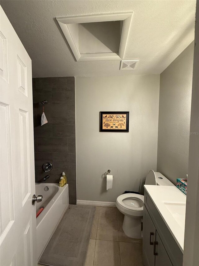 full bathroom featuring vanity, shower / washtub combination, a textured ceiling, and toilet