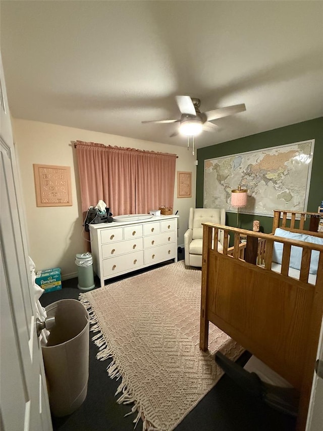 bedroom with ceiling fan and carpet