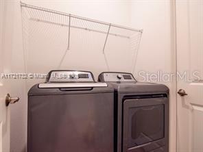 washroom with washer and dryer