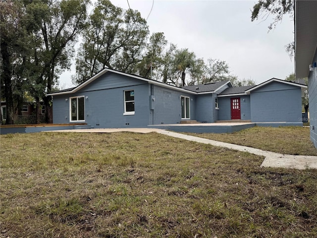 ranch-style house with a front lawn