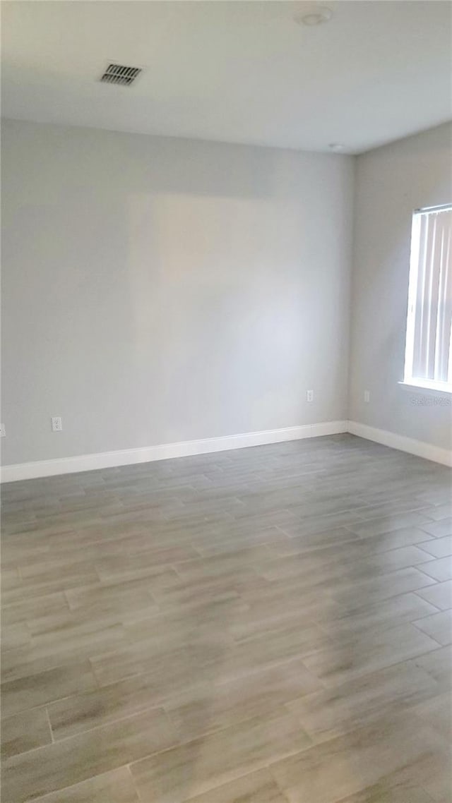 spare room featuring light hardwood / wood-style flooring