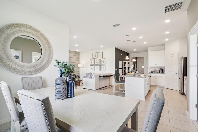 dining room featuring light tile patterned flooring