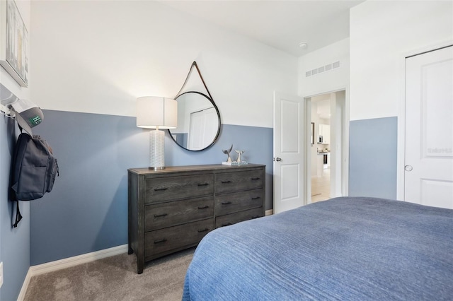 bedroom featuring light colored carpet