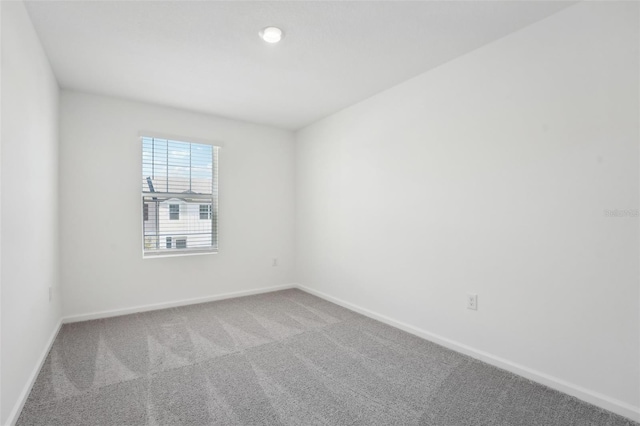 unfurnished room with carpet floors