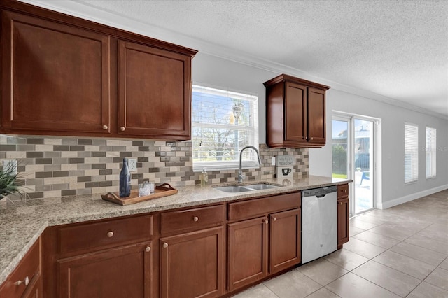 kitchen featuring dishwasher, ornamental molding, light stone countertops, and a sink