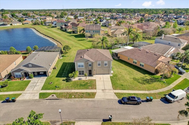 bird's eye view with a residential view and a water view