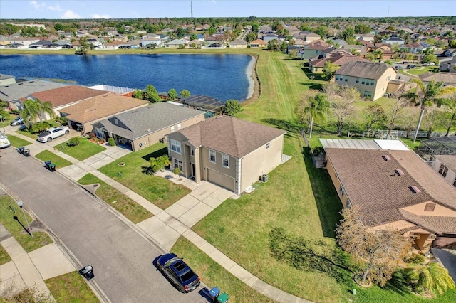 bird's eye view with a residential view and a water view