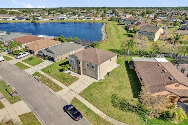 bird's eye view featuring a residential view and a water view