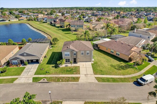 birds eye view of property featuring a residential view and a water view