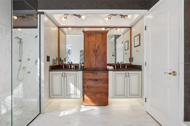 bathroom featuring an enclosed shower and vanity