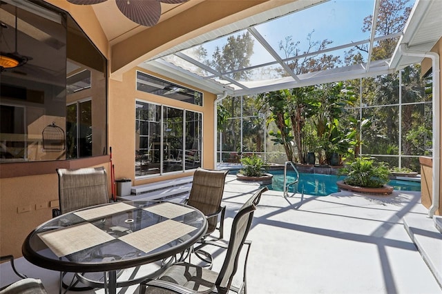 exterior space with a lanai and ceiling fan