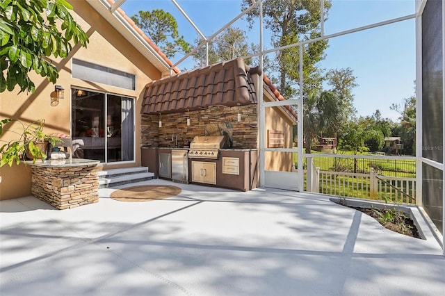 view of patio / terrace with exterior kitchen and area for grilling