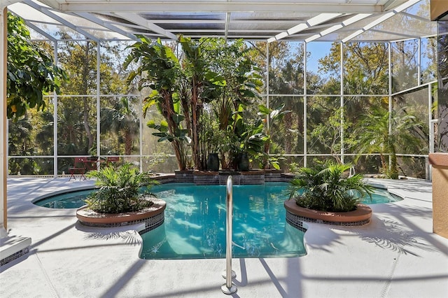 view of swimming pool with a patio area and a lanai