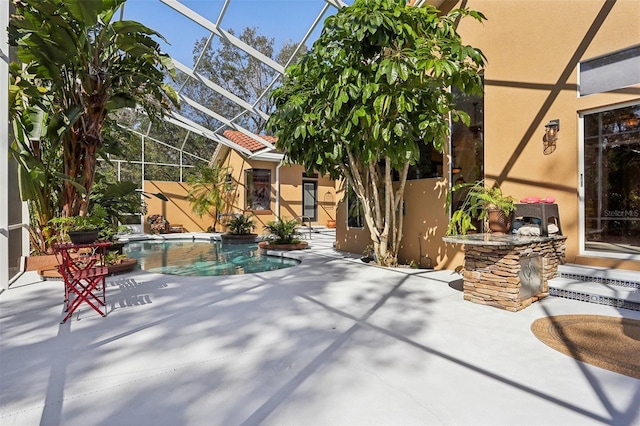 view of patio with glass enclosure