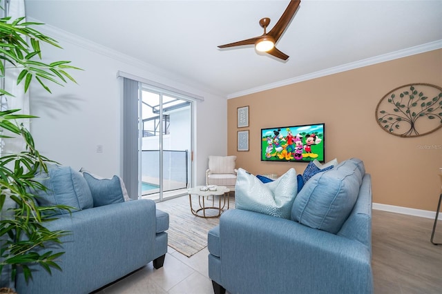 living room featuring ceiling fan, crown molding, and light tile patterned flooring