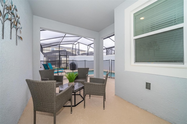 sunroom featuring vaulted ceiling