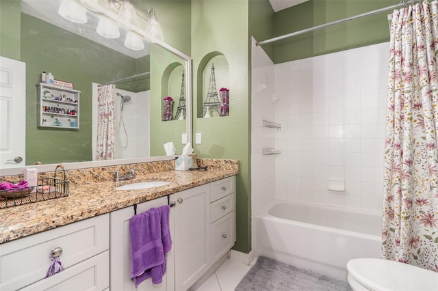 full bathroom with vanity, shower / bathtub combination with curtain, tile patterned floors, and toilet