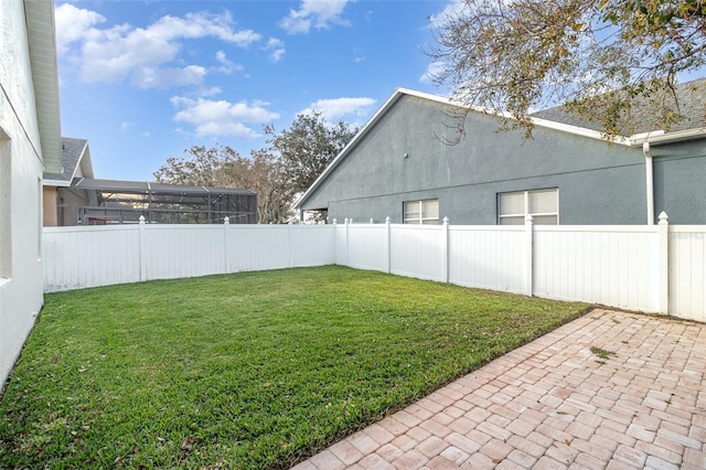 view of yard featuring a lanai