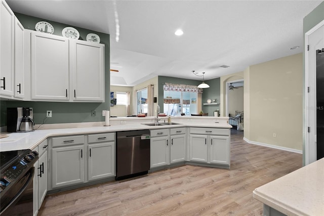 kitchen featuring light countertops, stainless steel dishwasher, white cabinetry, a sink, and black / electric stove