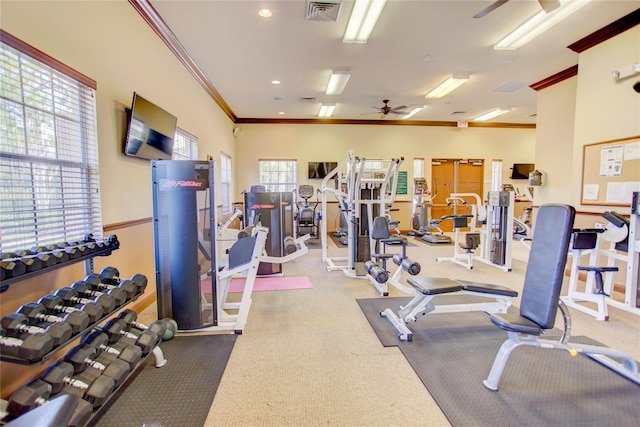 exercise room with ornamental molding, recessed lighting, visible vents, and ceiling fan