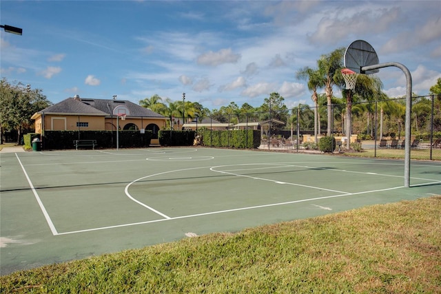 view of basketball court with community basketball court and fence