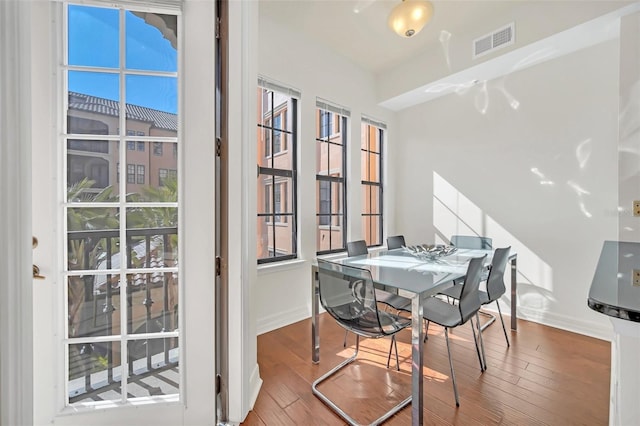 dining space featuring hardwood / wood-style floors