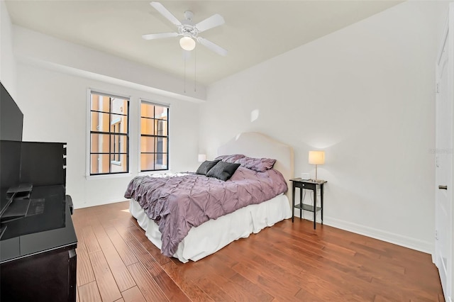 bedroom featuring hardwood / wood-style flooring and ceiling fan