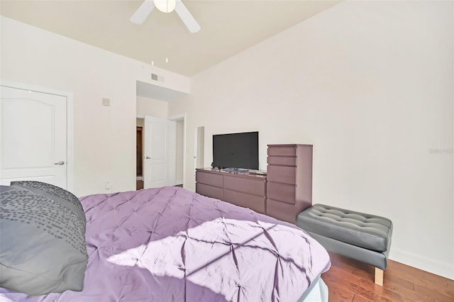 bedroom with hardwood / wood-style flooring and ceiling fan