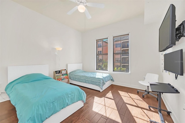 bedroom featuring ceiling fan and dark hardwood / wood-style floors