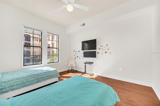 bedroom with ceiling fan and light wood-type flooring