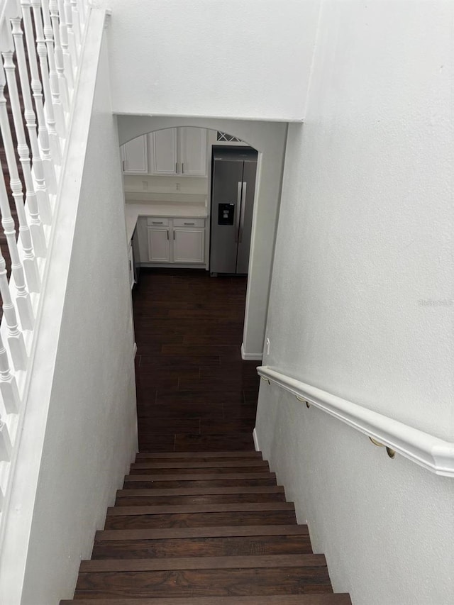 stairway featuring hardwood / wood-style flooring