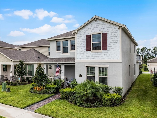 view of front of house featuring a front lawn and a porch